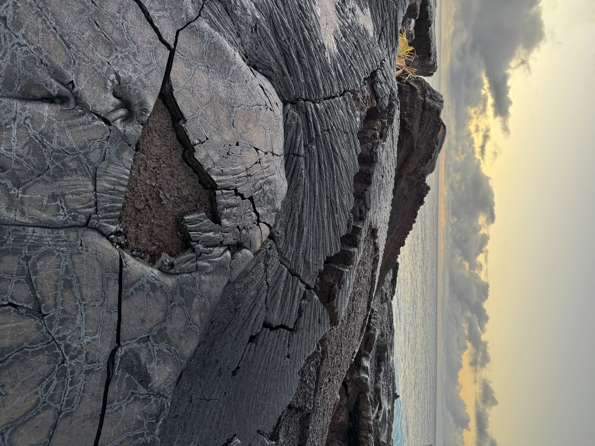 Pāhoehoe lava field running down to the ocean on the Big Island at dawn