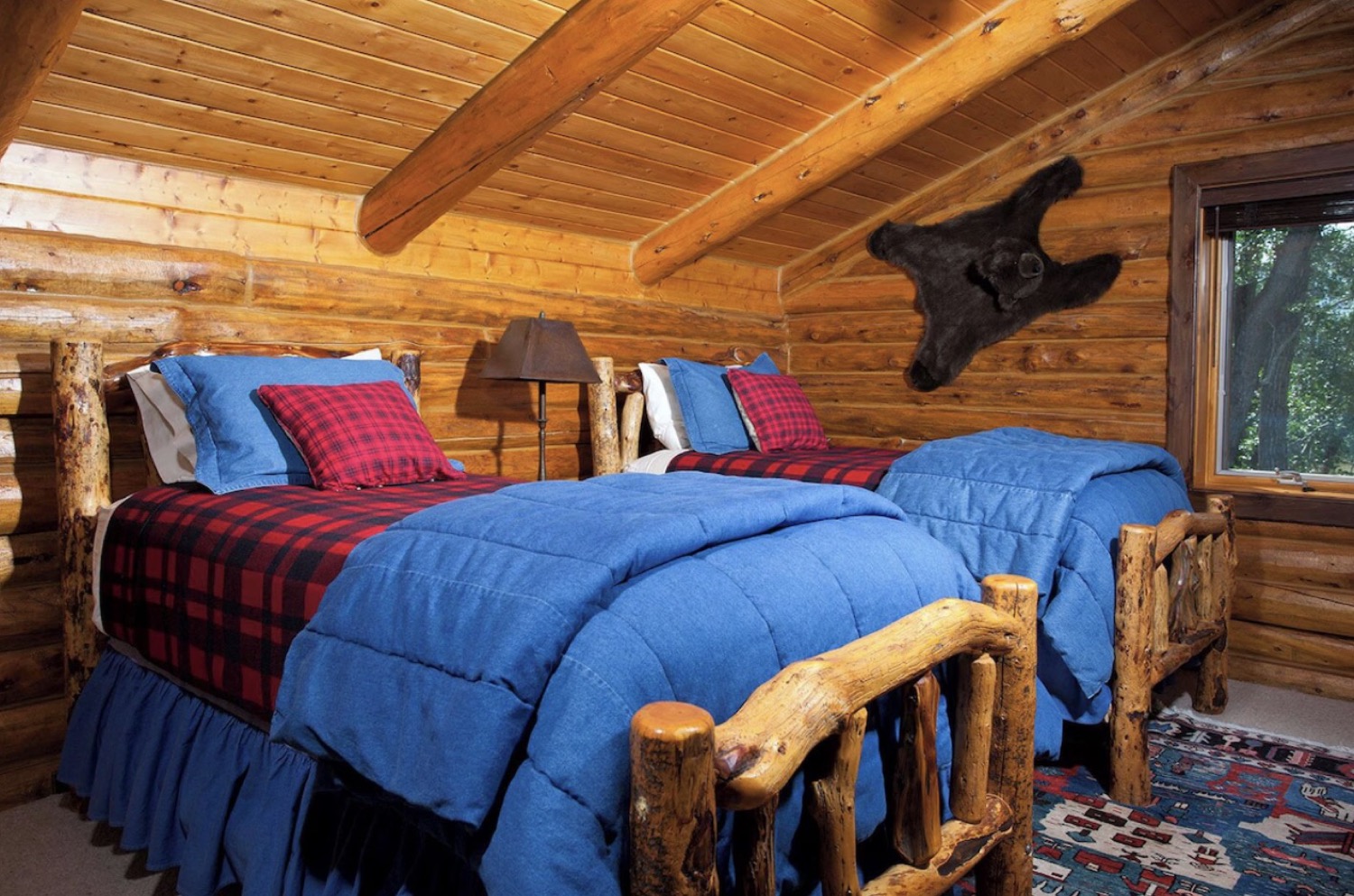 A log-framed bedroom in the lodge