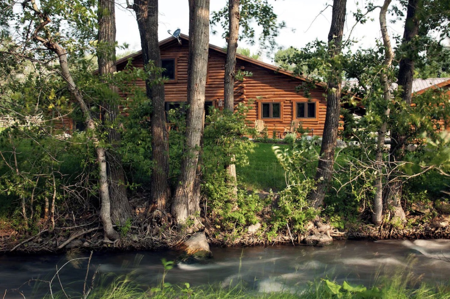 A log lodge beside a creek in Montana